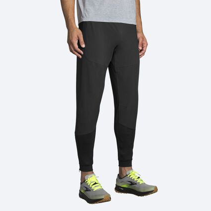 Model angle (relaxed) view of Brooks Switch Hybrid Pant for men