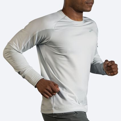 Movement angle (treadmill) view of Brooks Notch Thermal Long Sleeve for men