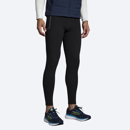 Model angle (relaxed) view of Brooks Momentum Thermal Tight for men