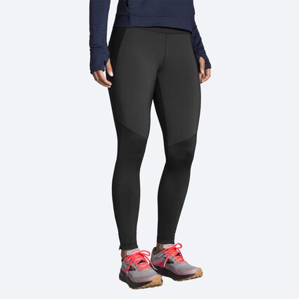 Model angle (relaxed) view of Brooks Switch Hybrid Tight for women
