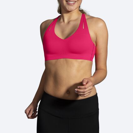 Model angle (relaxed) view of Brooks Dare Strappy Run Bra for women