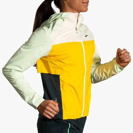 Movement angle (treadmill) view of Brooks High Point Waterproof Jacket for women