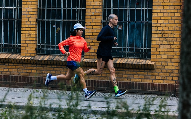 Runners on a boardwalk