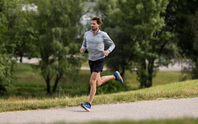 Runner running through a park