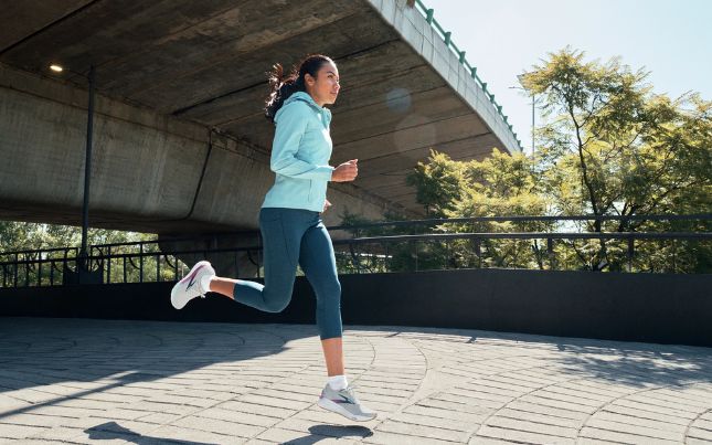woman running in brooks shoes
