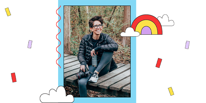 Photographer Steph Grant sitting on a boardwalk in the forest