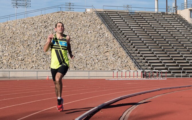 Colleen running around a track