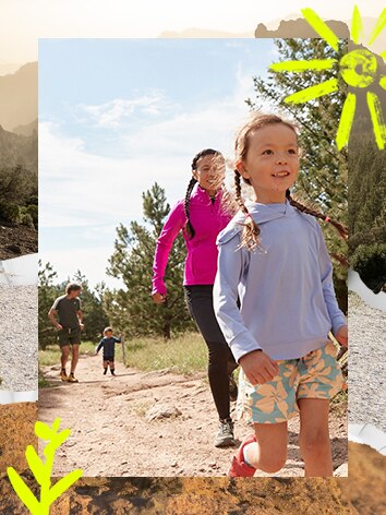 A man and a woman running on trail with two kids