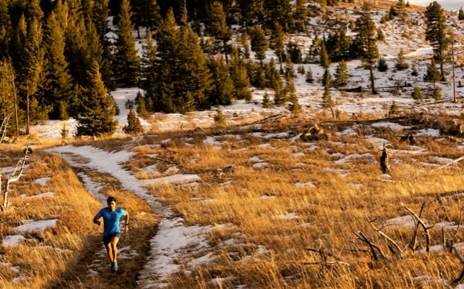 A solor runner on a run on a trail