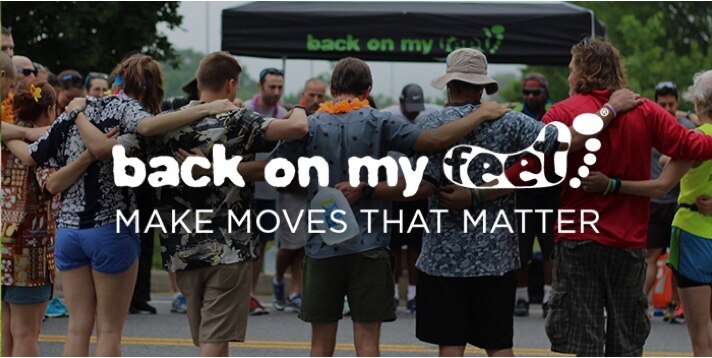 Runners forming a circle with text saying "back on my feet, make moves that matter."