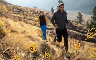 Two runners on a mountain trail