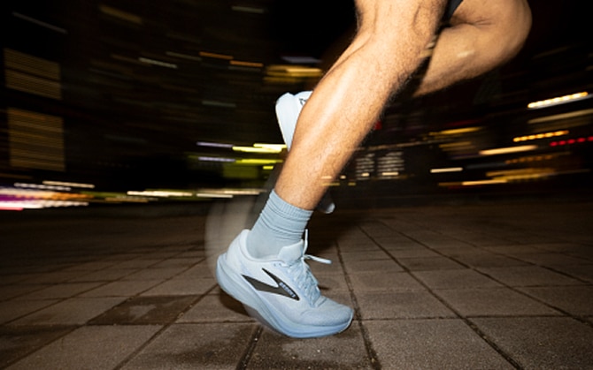 Close-up of someone’s feet wearing the Ghost 18 on the concrete stairs