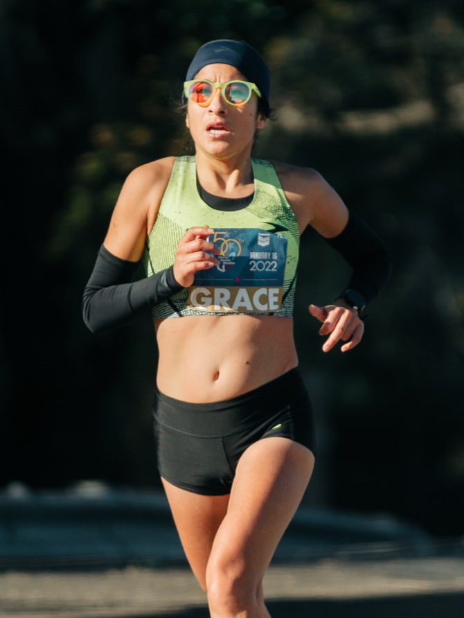 Front view of Grace Gonzales running a marathon
