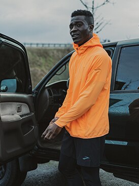 Runner getting into a car.