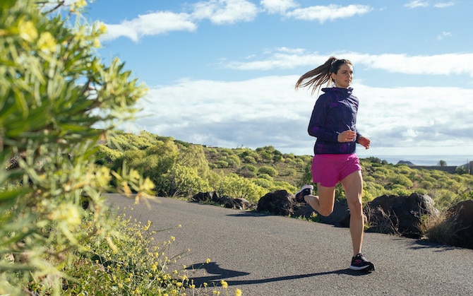 Woman running on a trail