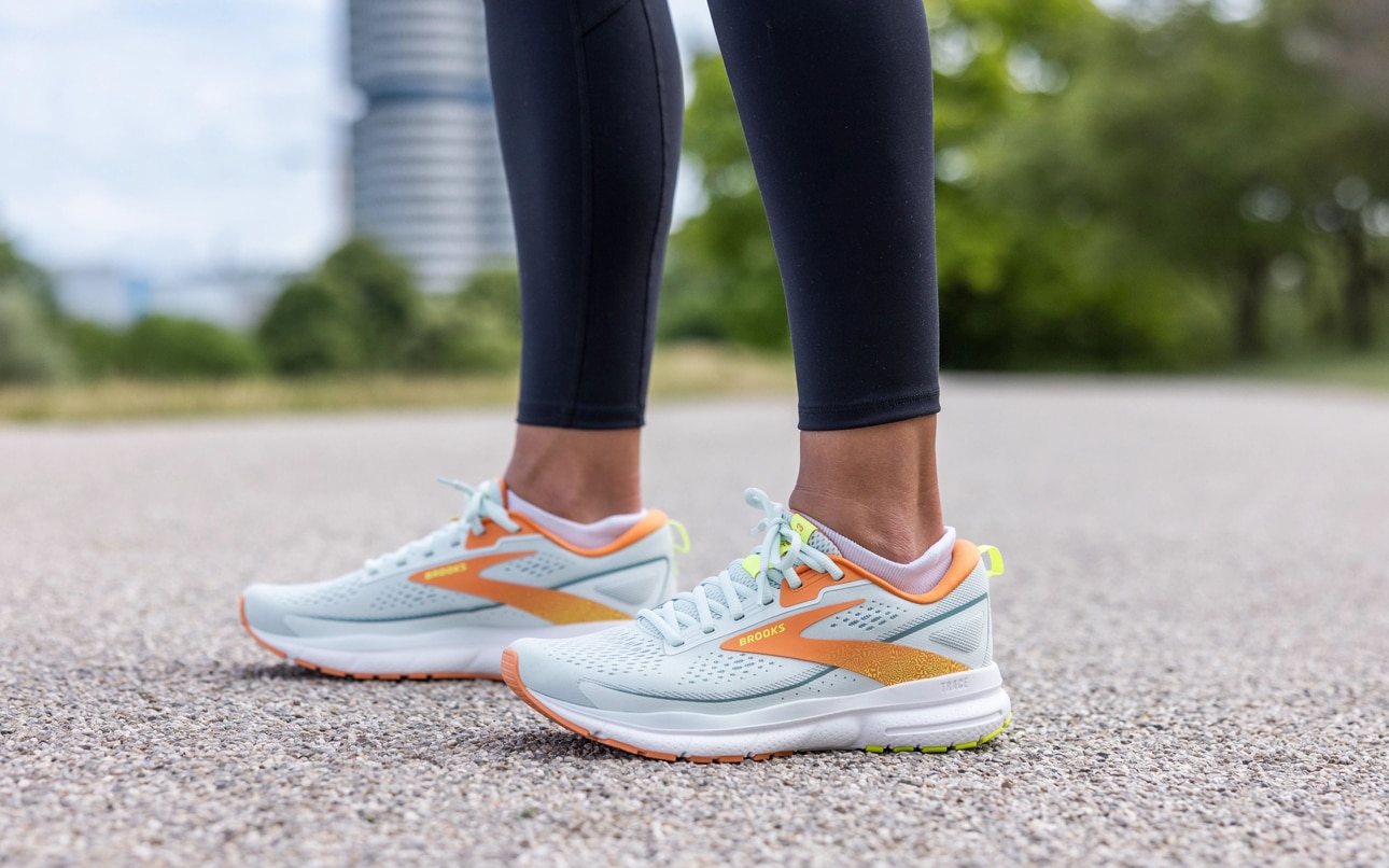 A runner posing in a pair of running shoes