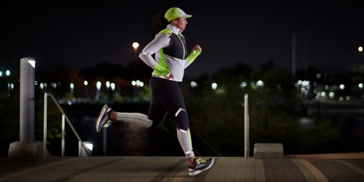 Runner in run visible apparel glowing in the dark