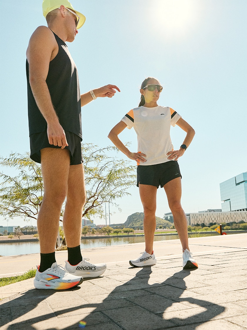 Illustration of a runner’s legs and feet running toward a horizon with the sun shining in the distance.