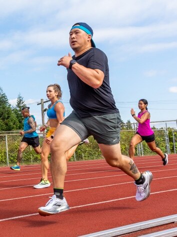 Runners racing on track