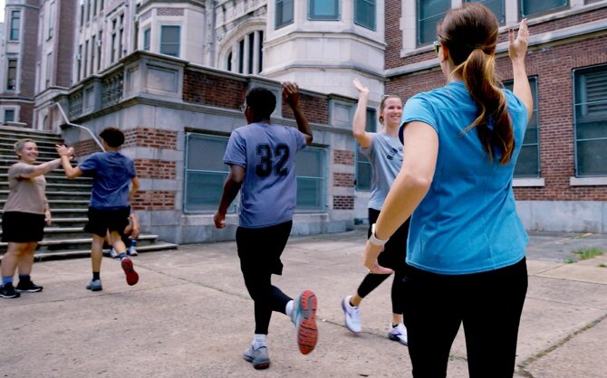 Runners exchanging high fives