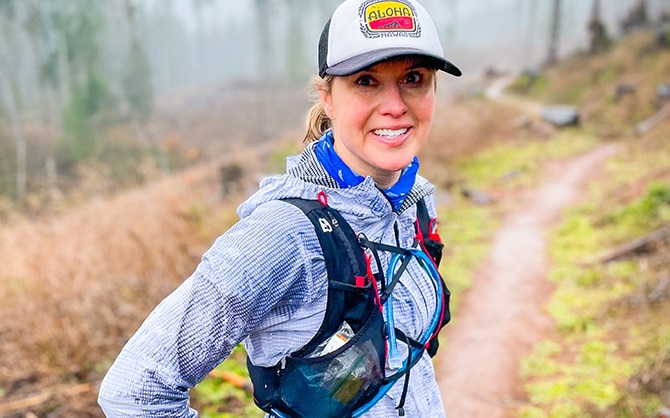 Runner on a trail runner through the forest