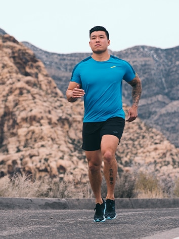A man running in a canyon