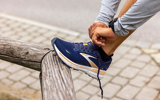 close up of someone wearing Brooks Adrenaline GTS 23 running shoes