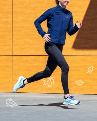 Woman running in a switch hybrid tights