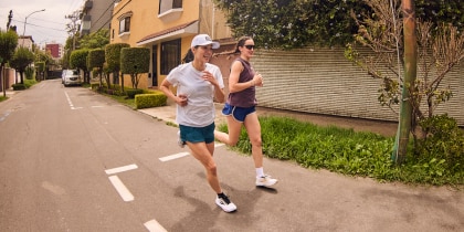 Two women running outside