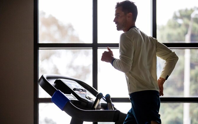 man running on treadmill