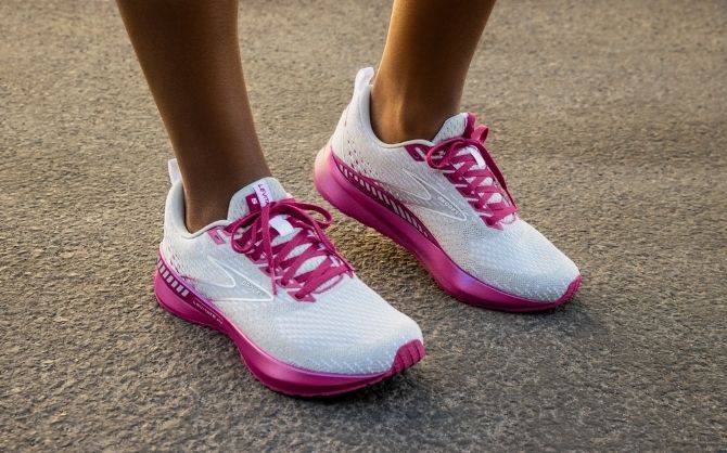 Close up of pink and white Levitate Brooks shoes