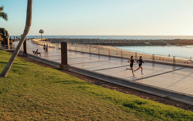 Runners on a boardwalk