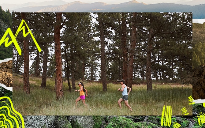 Side view of a man and a woman running in the woods