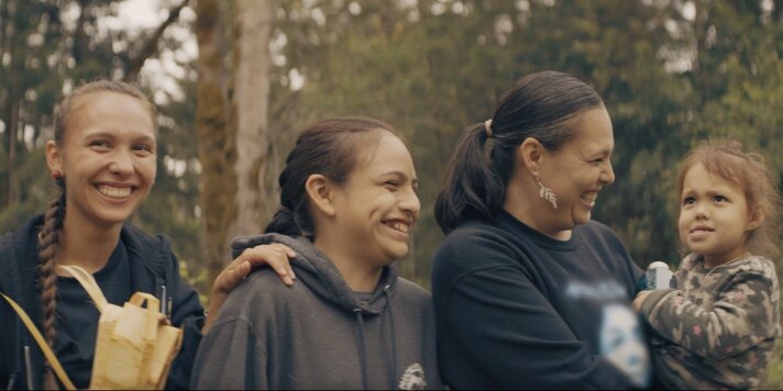 four women smiling