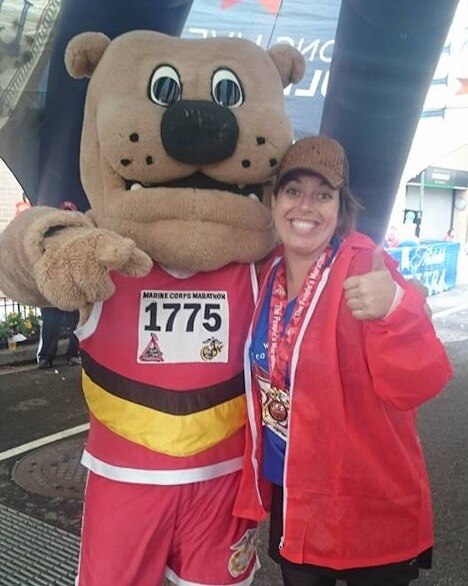 Mascot with a marathon runner