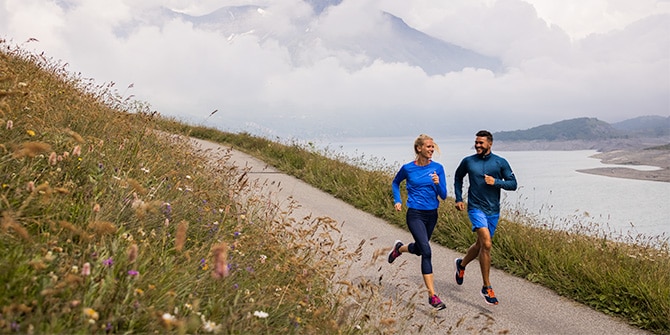 Two runners on a trail