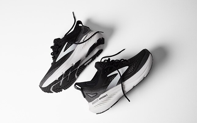 A pair of black Brooks Glycerin GTS 23 running shoes on a white background.