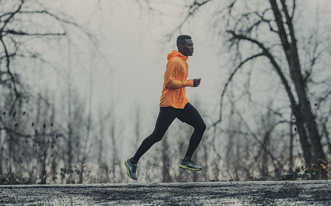 Runner on a dark, cold, wet day