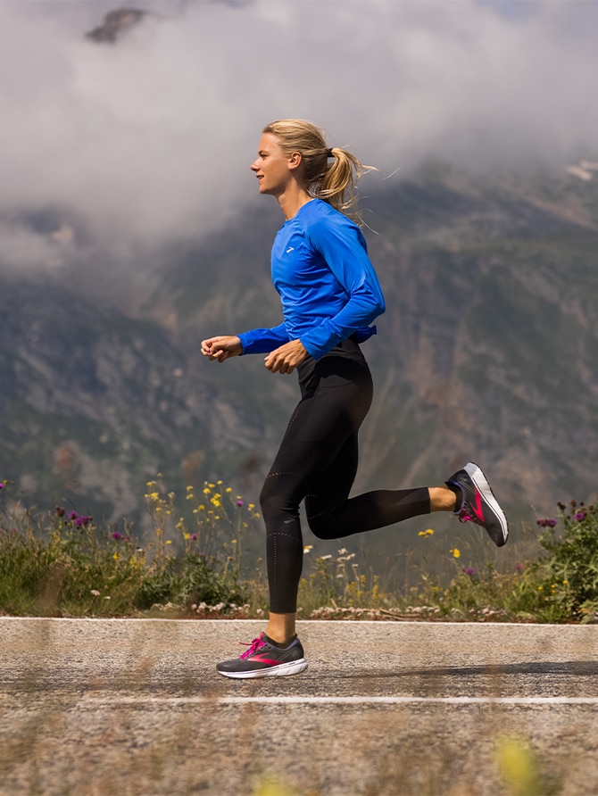 Close up view of a woman running on a trail