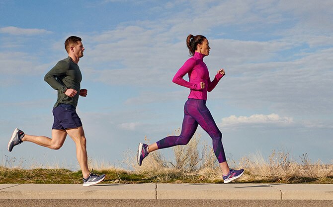 Two runners striding out