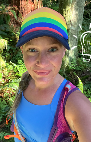 Woman taking a selfie on a run, wearing a rainbow hat