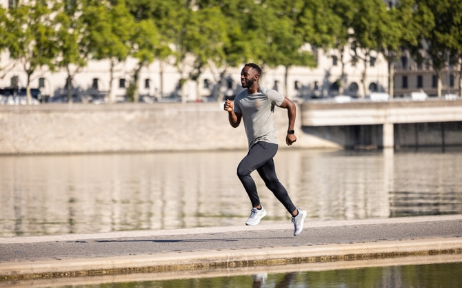 Runner running down the sidewalk