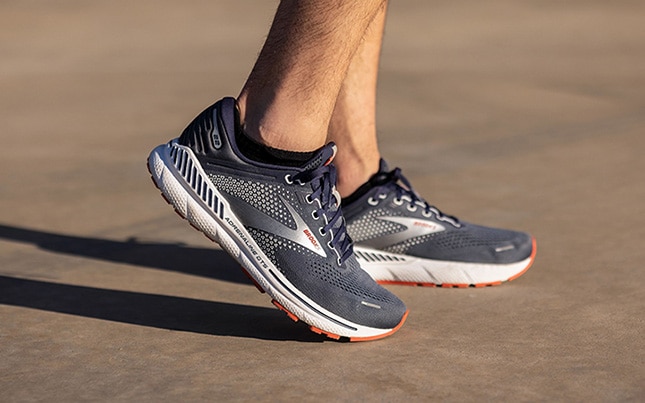 close up of someone wearing Brooks Adrenaline GTS 22 running shoes
