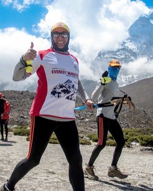 Zander Ross giving a thumbs up on a run
