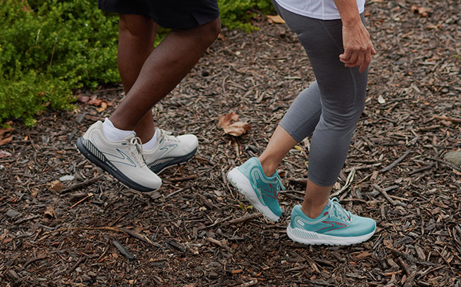 Two walkers on a dirt path
