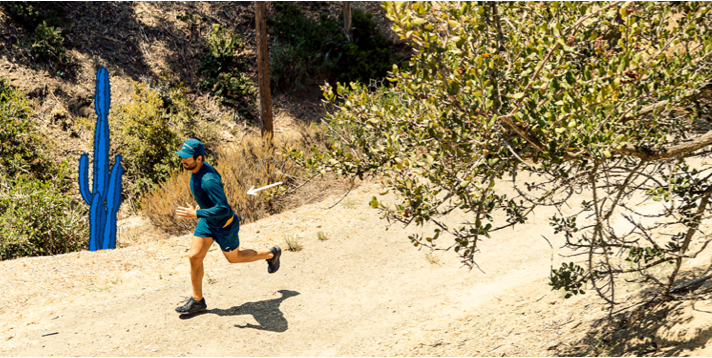 Tim Senesi running on a sunny path
