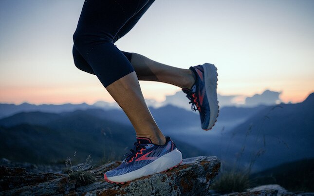 Side view of runner with sunset background