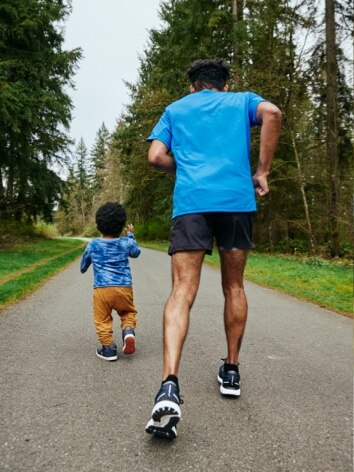 Amir running with his son