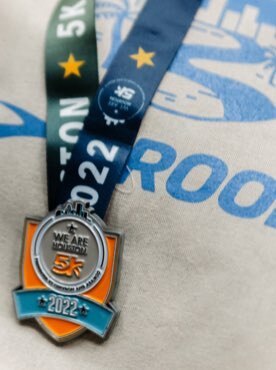 Close up view of medal for We Are Houston 5K run