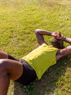 Tired runner laying on the grass